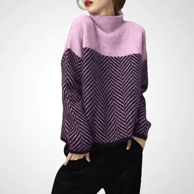 Person wearing a two-tone sweater with pink and purple patterns on a white background