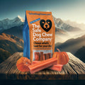 Bag of The Safe Dog Chew Company with dog chews and pumpkins on a wooden surface with mountain background