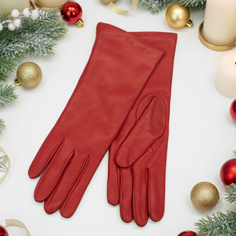 Pair of red gloves on a white background