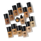 Collection of foundation bottles with black caps on a white background