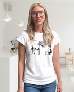 Person wearing a white t-shirt with a graphic design on a decorative background