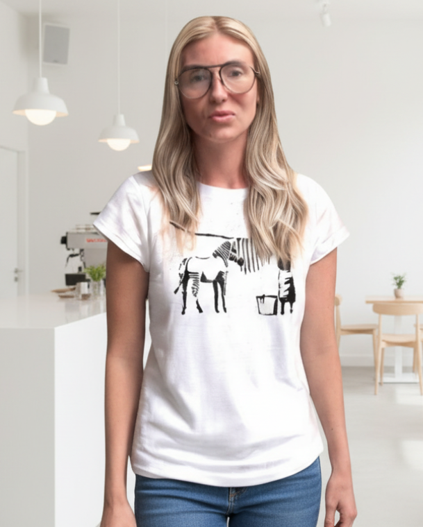 Person wearing a white t-shirt with a graphic design on a decorative background