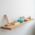 Bathroom shelf with various items next to a bathtub