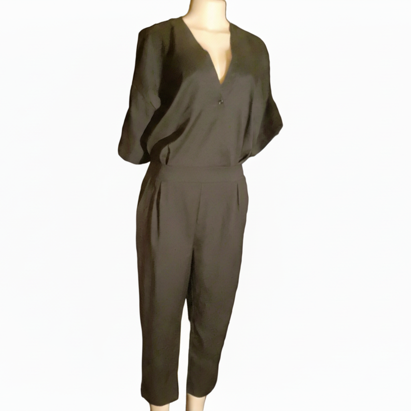 Brown jumpsuit on a mannequin against a white background