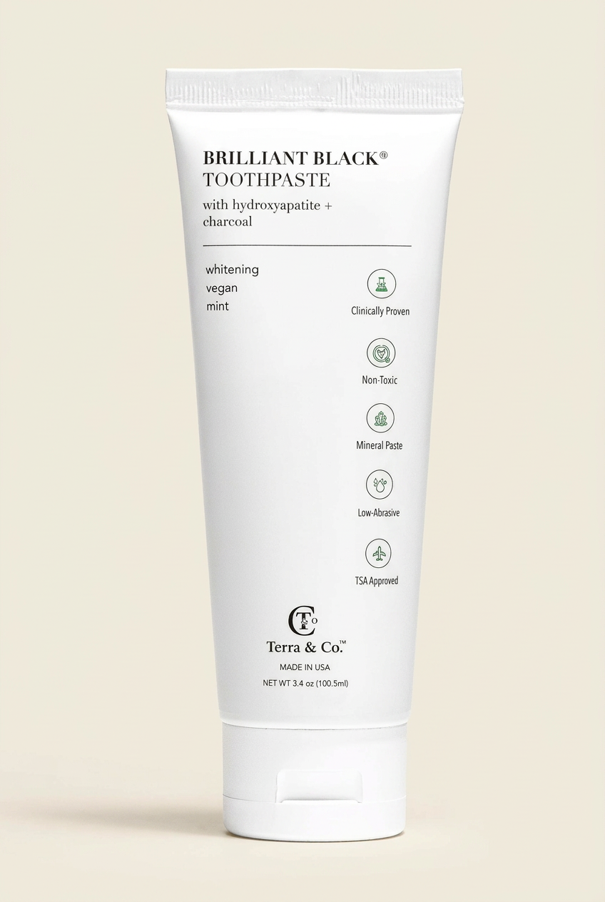 Tube of Brilliant Black Toothpaste with Terra & Co. branding on a white background