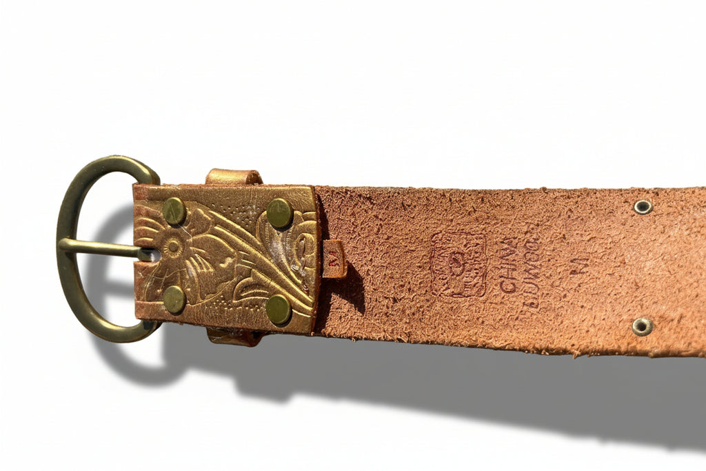 Brown leather belt with brass buckle