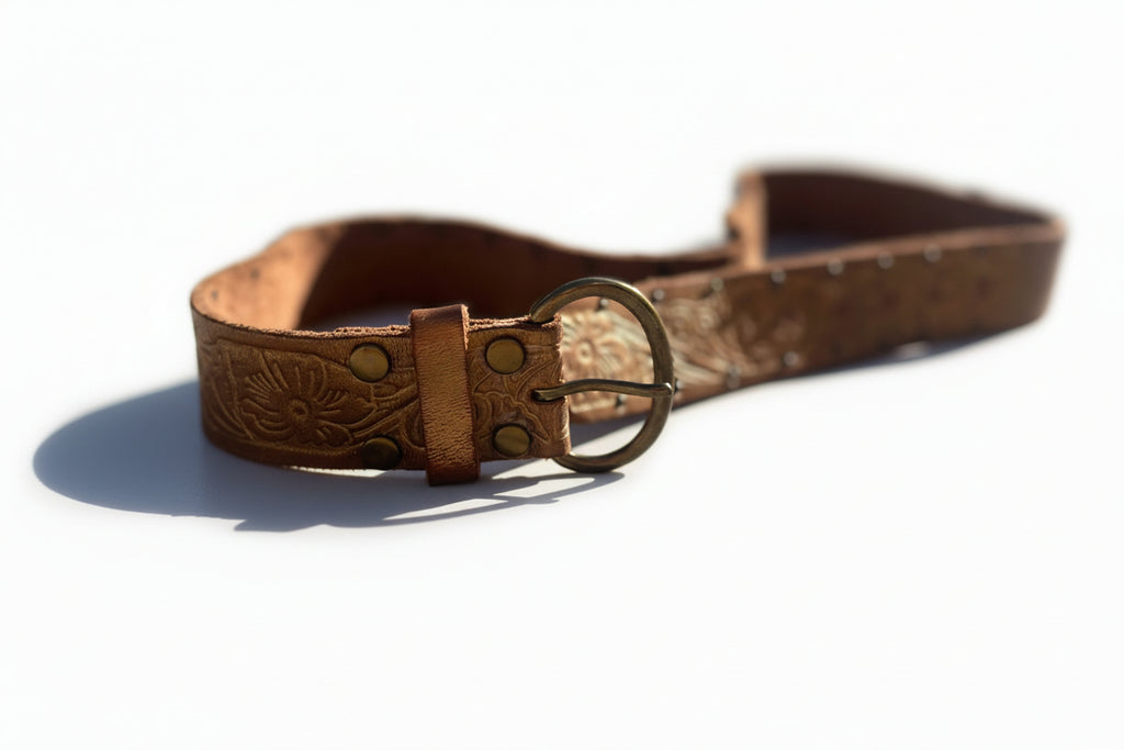 Brown leather belt with gold embossed design