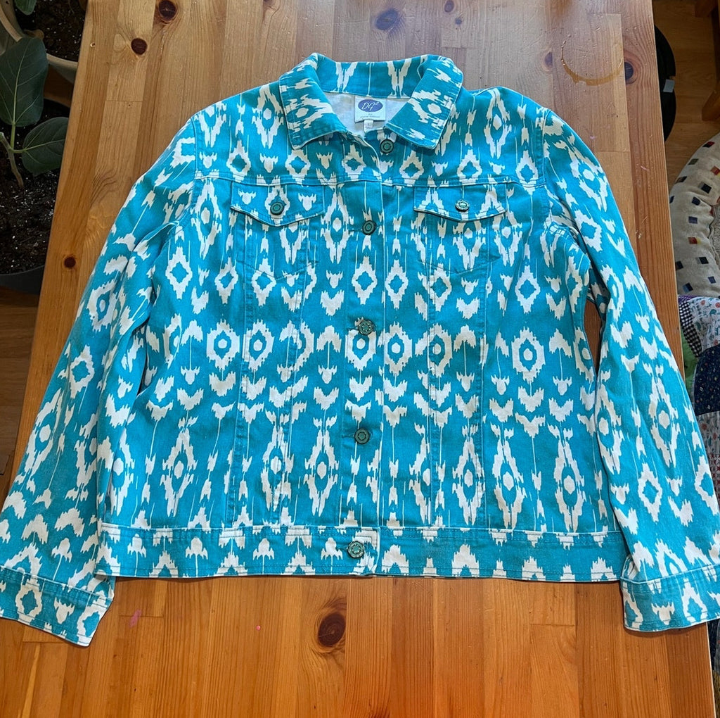 Blue and white patterned jacket on a wooden table