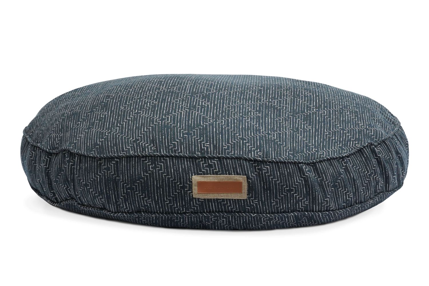 Round blue pet bed with a textured pattern on a white background