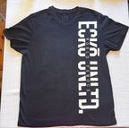 A black short-sleeve V-neck t-shirt with bold white vertical text reading 'ECKO UNLTD' and smaller text 'WORLD FAMOUS' down the right side, laid flat on a light-colored textured fabric surface.