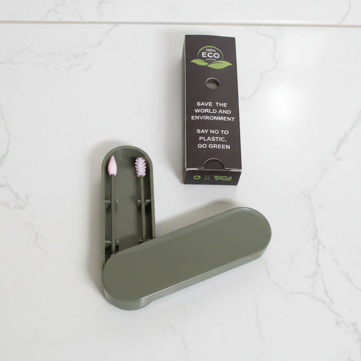 Green swab holder and packaging on a white background