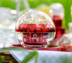 Epilynx gluten-free product in a clear sphere with a red interior on a blurred outdoor background