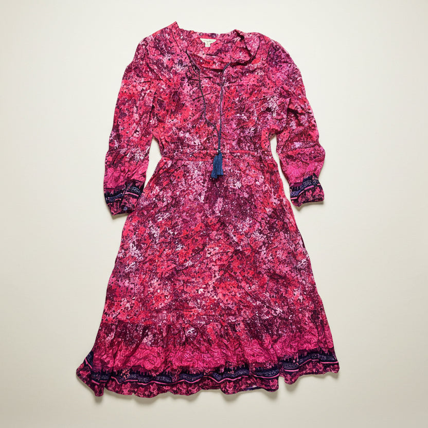 Pink floral dress with long sleeves on a white background