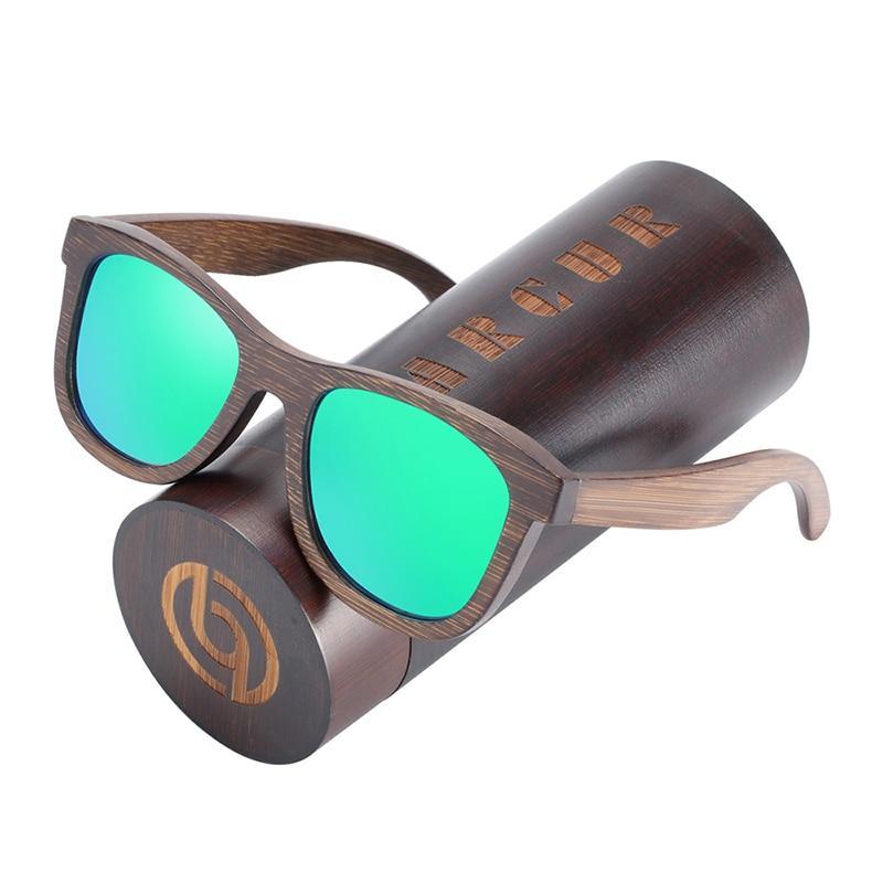 Wooden sunglasses with green lenses and matching case on a white background