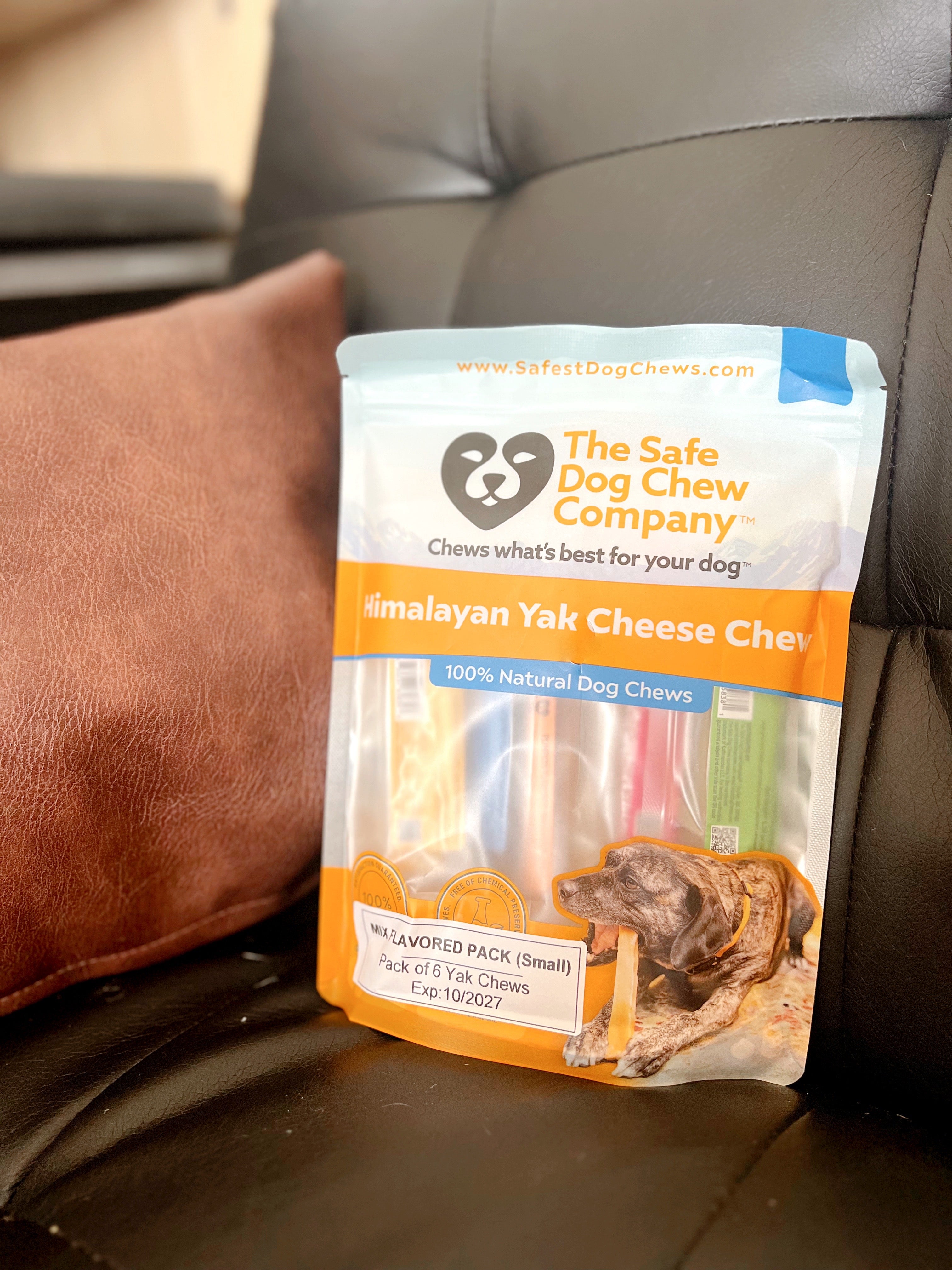 Package of 'The Safe Dog Chew Company' Malayan Yak Cheese Chews on a car seat.