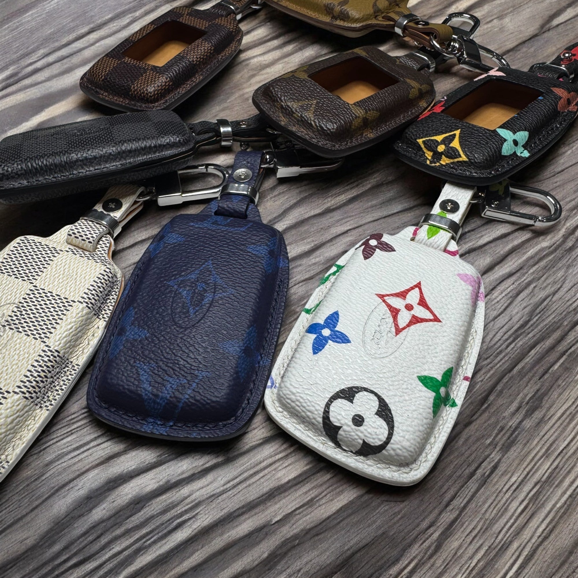 Collection of various keychains on a marble surface