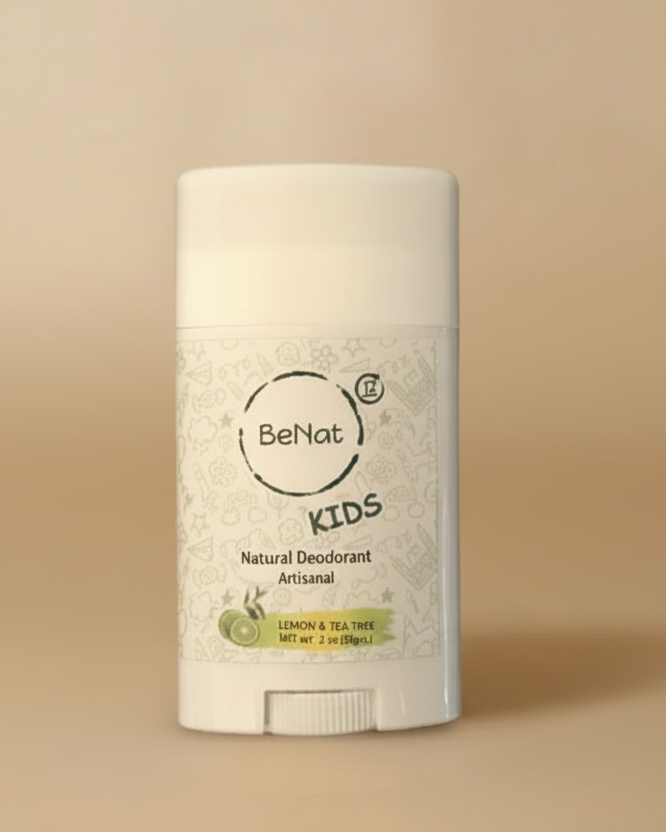 Be'nat Kids natural deodorant stick on a wooden surface with towels in the background