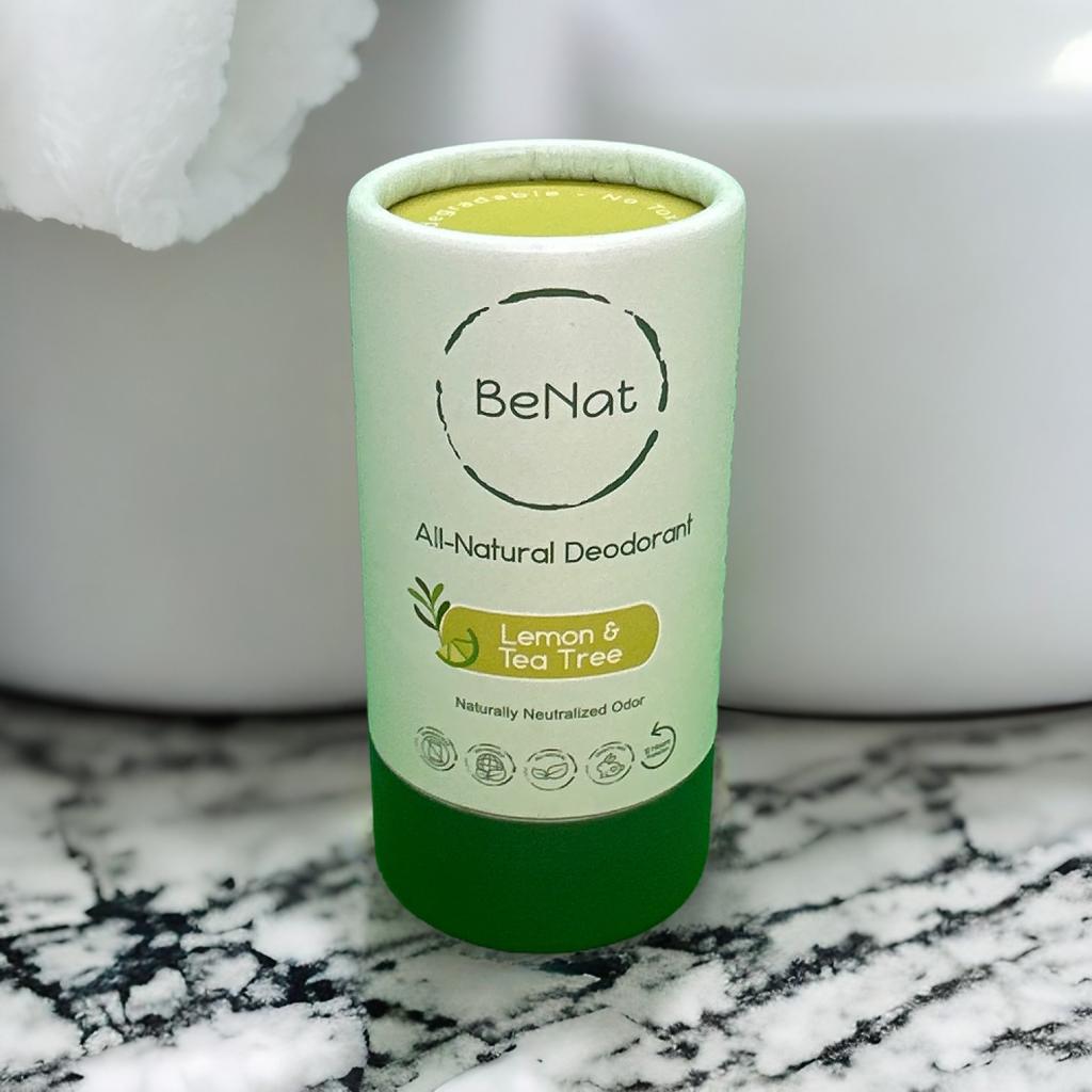 Green deodorant container with 'BeNat' branding on a marble surface