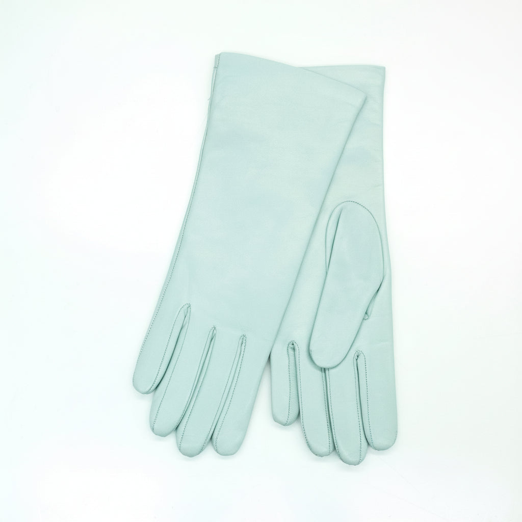 Pair of light blue gloves on a white background