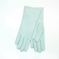 Pair of light blue gloves on a white background