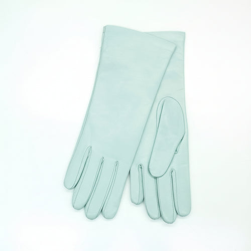 Pair of light blue gloves on a white background