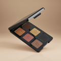 Makeup palette with six different shades on a beige background