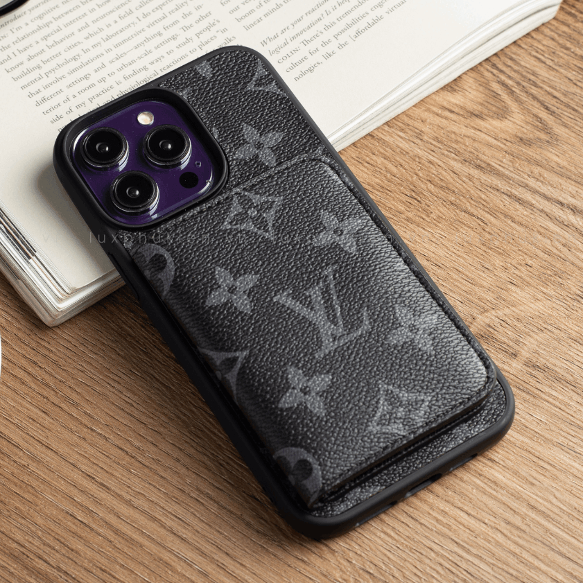 Black phone case with brand logo on a wooden surface