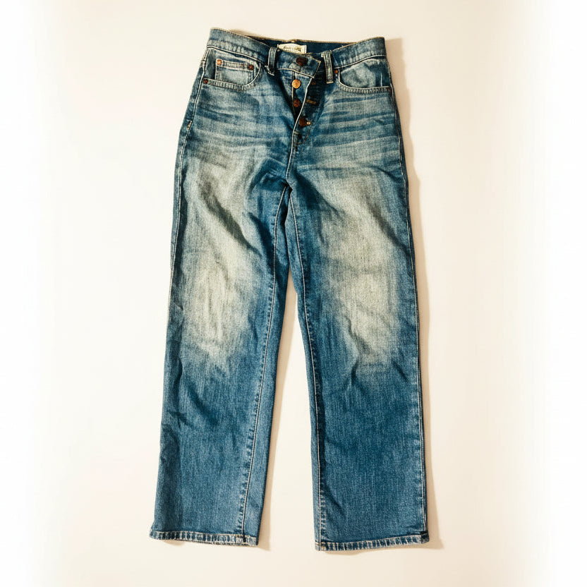 Pair of blue jeans on a wooden floor