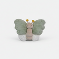 Butterfly-shaped plush toy on a white floor