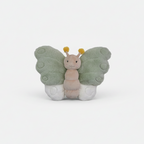 Butterfly-shaped plush toy on a white floor