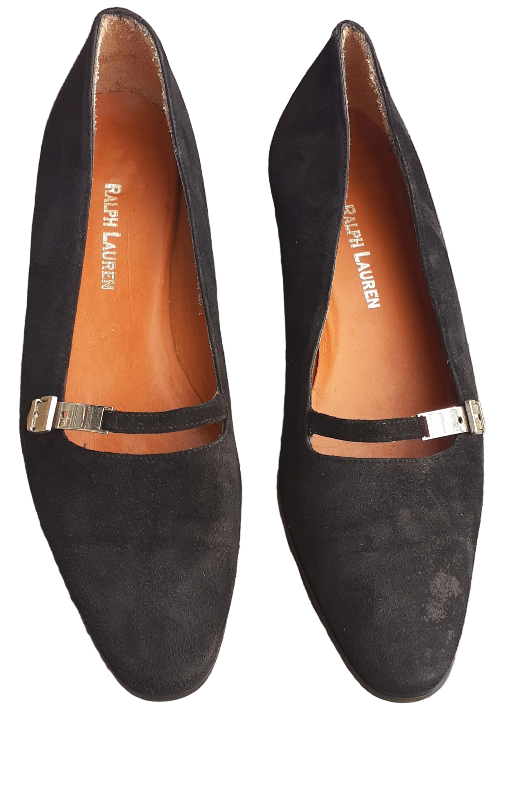 Black suede shoes with gold accents on a white background