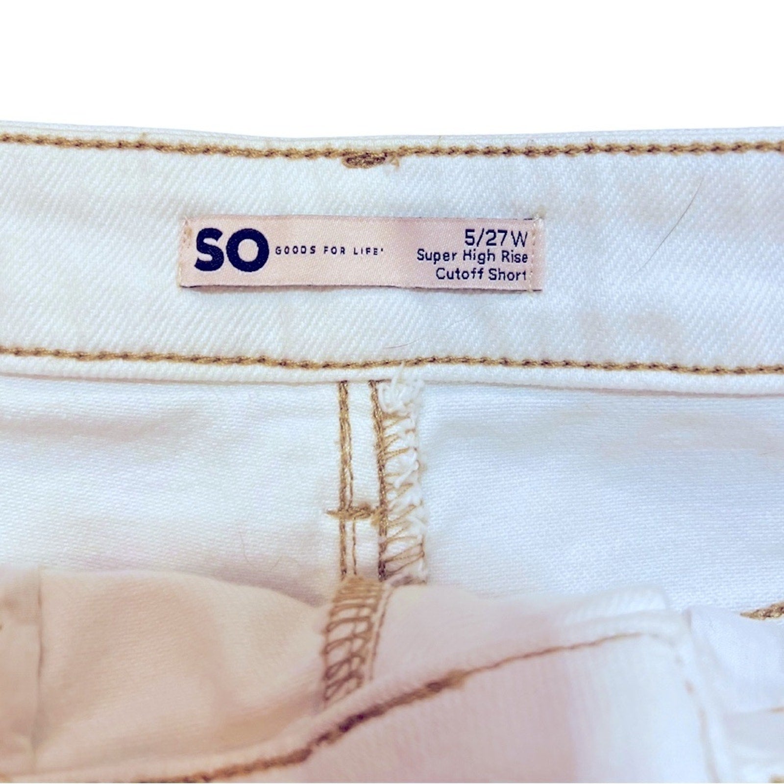 Close-up of a denim label on a white background