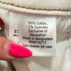 Clothing label with text on a white fabric background
