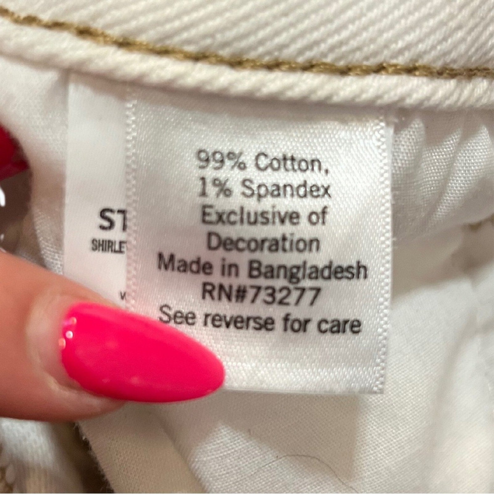 Clothing label with text on a white fabric background