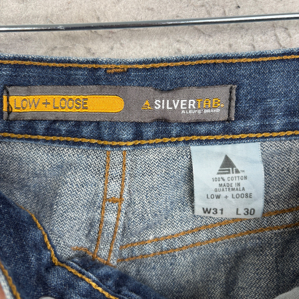 The DESTROYED Vintage Y2K Levi's Silvertab Low Loose Dark Wash Jeans