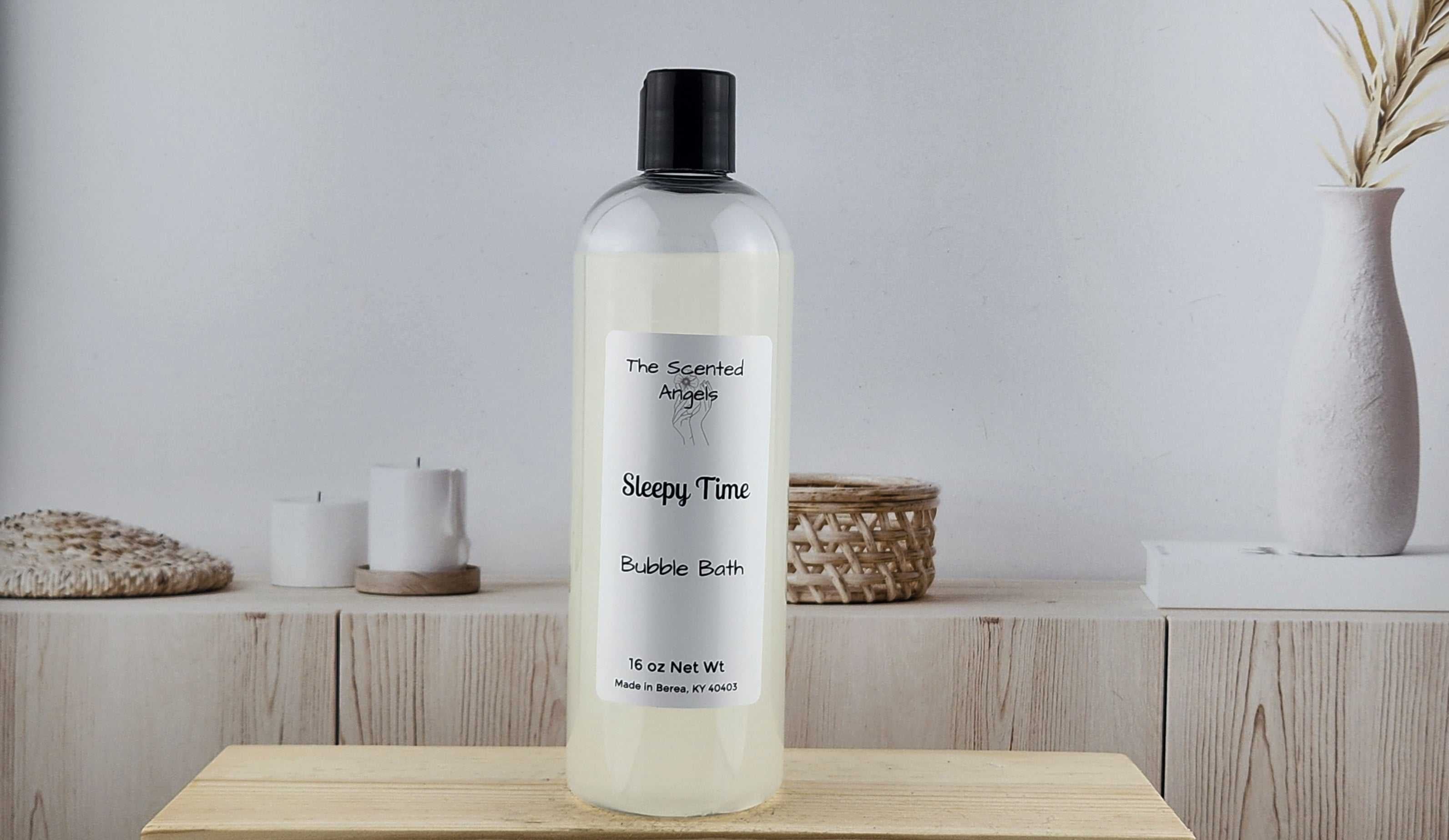 Bottle of bubble bath labeled 'Sleepy Time' on a wooden surface with a neutral background