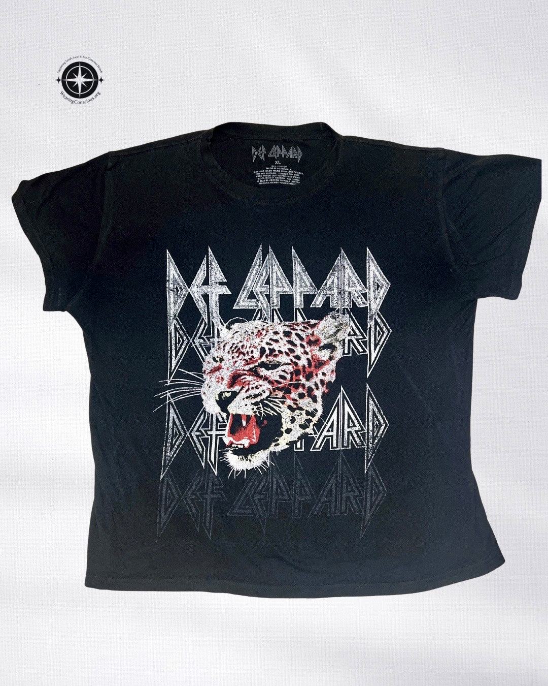 A black short-sleeve graphic t-shirt featuring the band Deftain and their 'Leopard' album artwork, displayed flat against a light gray background.