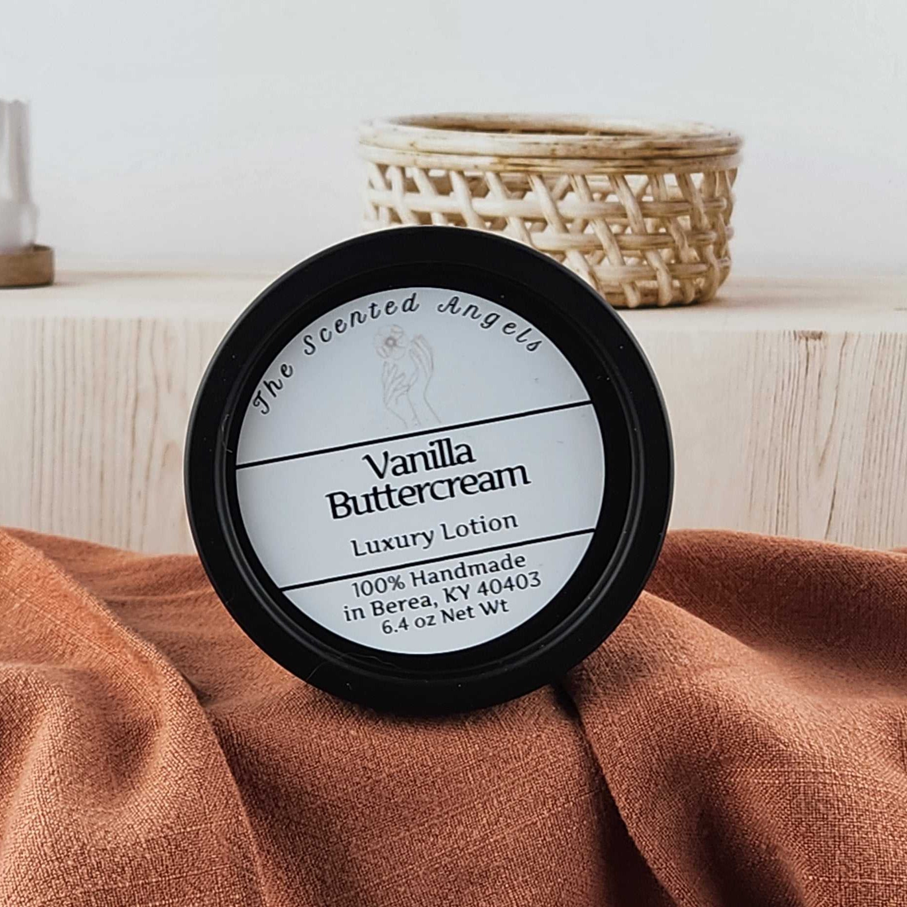 Vanilla Buttercream luxury lotion on a brown towel with a neutral background