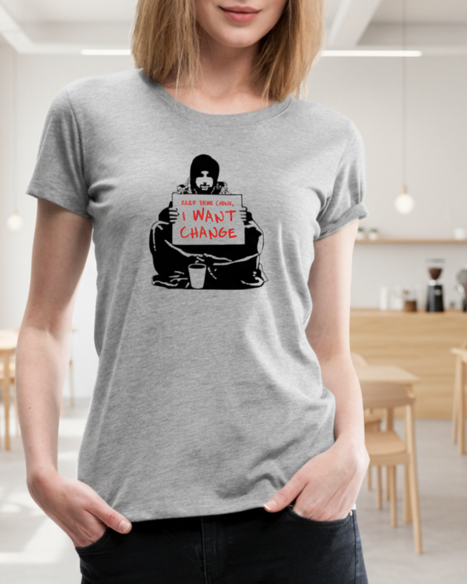 Person wearing a gray t-shirt with a graphic design in a casual setting